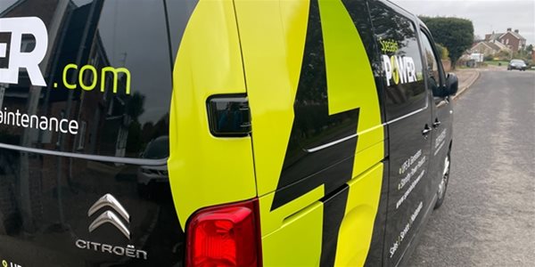 Photo of Specialist Power engineers van showing large logo on the side