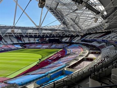 Image of the London Stadium from the stands looking out onto the pitch