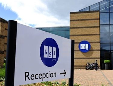 Reception sign of the BGL head office in Peterborough with building in the background