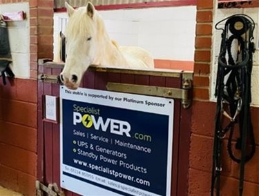 Specialist Power sponsorship board on the stable front