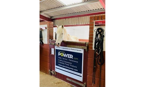 Specialist Power platinum sponsor sign on the Elisabeth Curtis stable